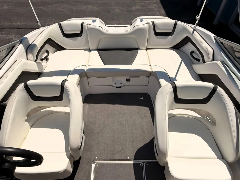 Slide: The Image of 2016 Yamaha Boats SX190 interior with white seating and gray carpet. - 7