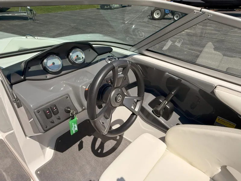 Slide: The Image of 2016 Yamaha Boats SX190 cockpit with steering wheel and dashboard controls. - 8