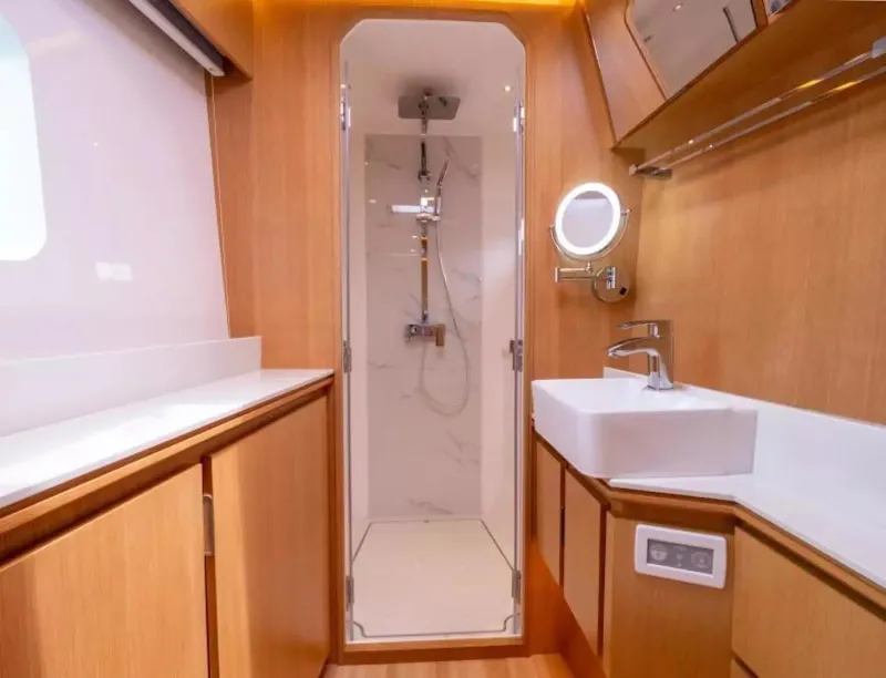 Slide: The Image of Luxurious bathroom interior of 2026 McConaghy MC63P Tourer yacht, featuring modern fixtures and wood accents. - 17