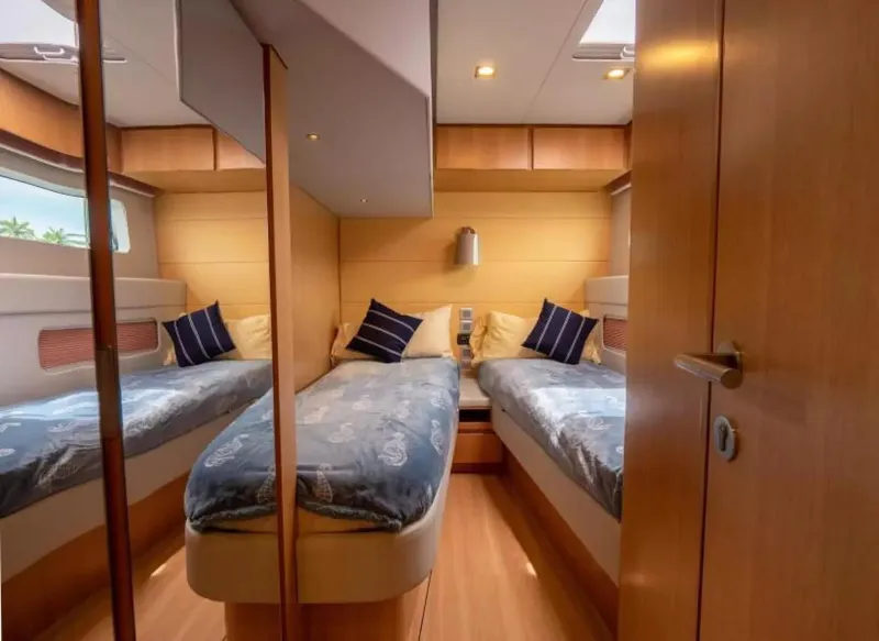 Slide: The Image of 2026 McConaghy MC63P Tourer cabin with twin beds, modern design, and wooden interior. - 24