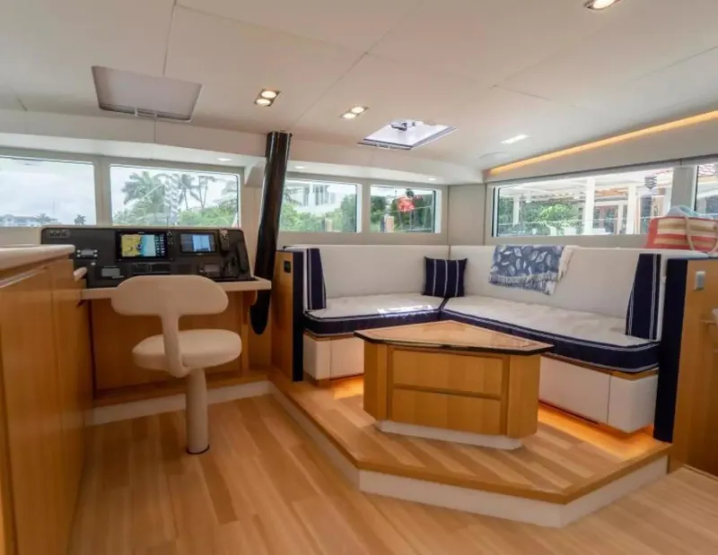 Slide: The Image of Luxurious interior of 2026 McConaghy MC63P Tourer yacht with modern seating and navigation area. - 8