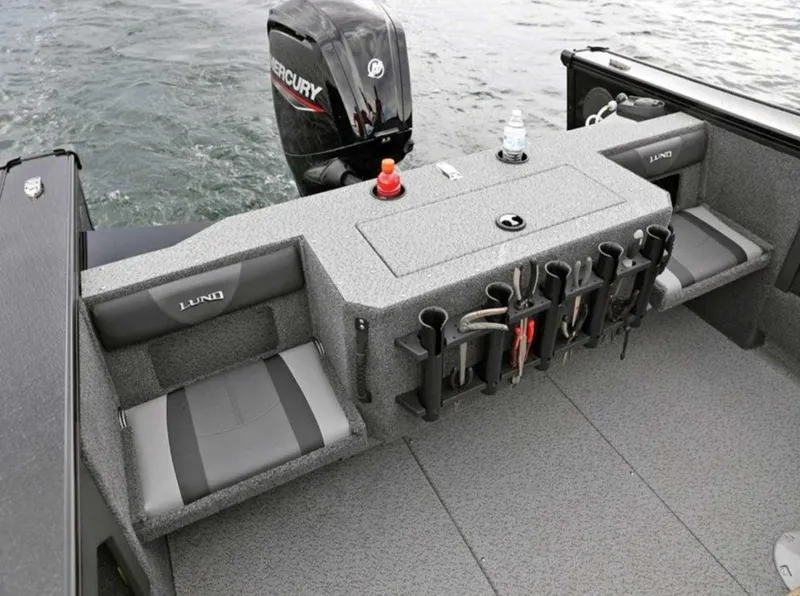 Slide: The Image of 2026 Lund 1875 Fisherman boat interior with seating and fishing rod holders. - 7