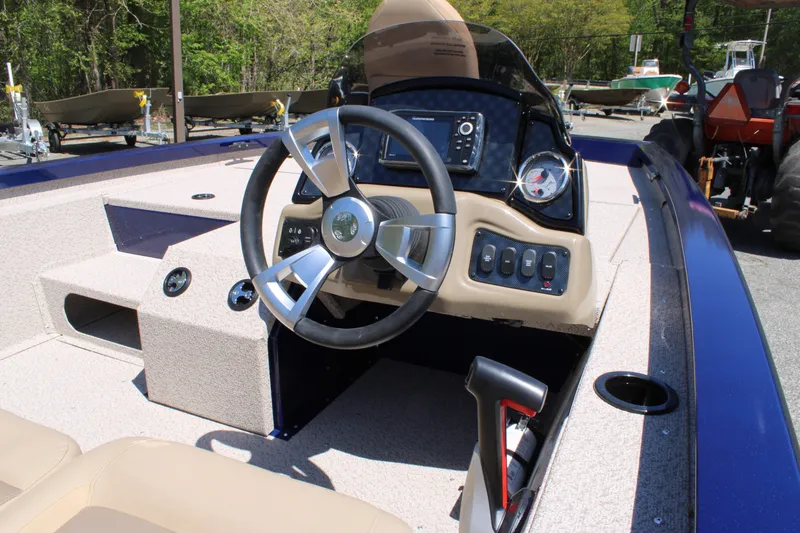 Slide: The Image of 2025 G3 Sportsman 1710 boat interior with steering wheel and control panel. - 10