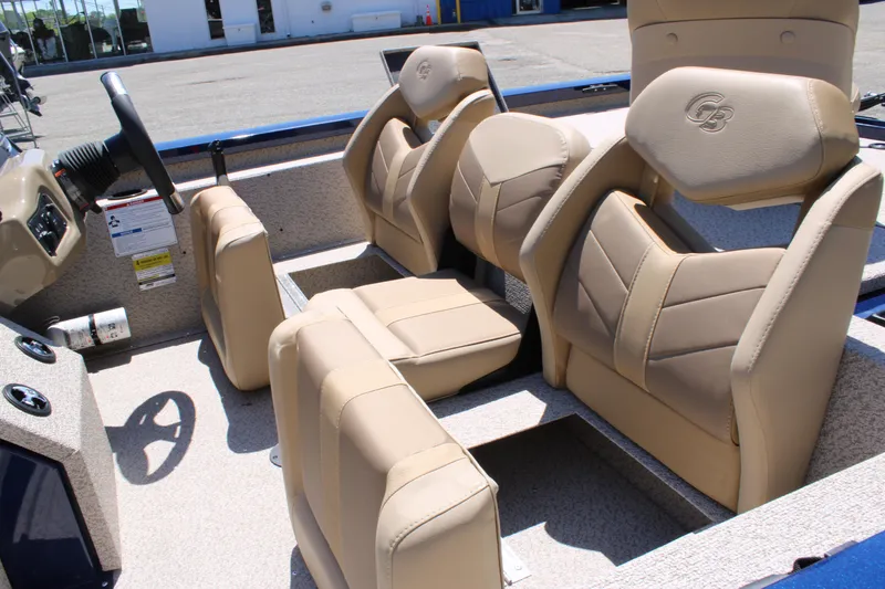 Slide: The Image of 2025 G3 Sportsman 1710 boat interior with beige seating and steering console. - 12