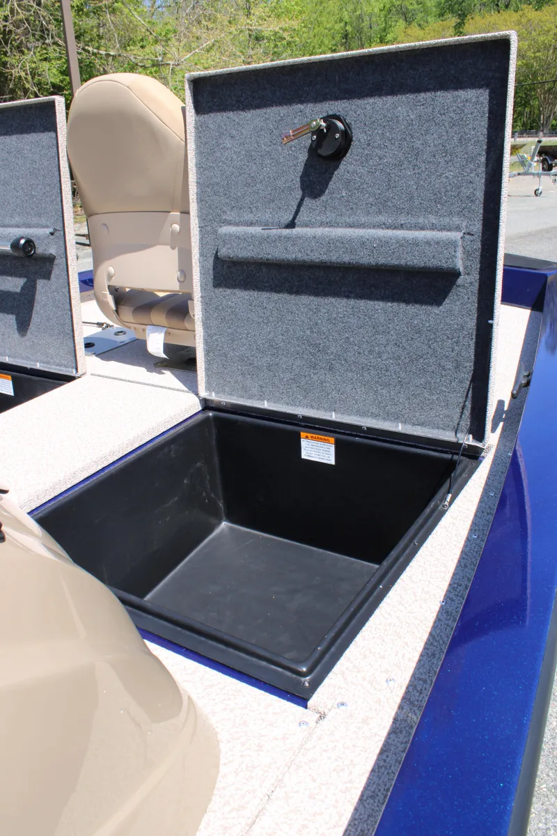 Slide: The Image of 2025 G3 Sportsman 1710 boat storage compartment with open lid, showcasing interior space. - 19