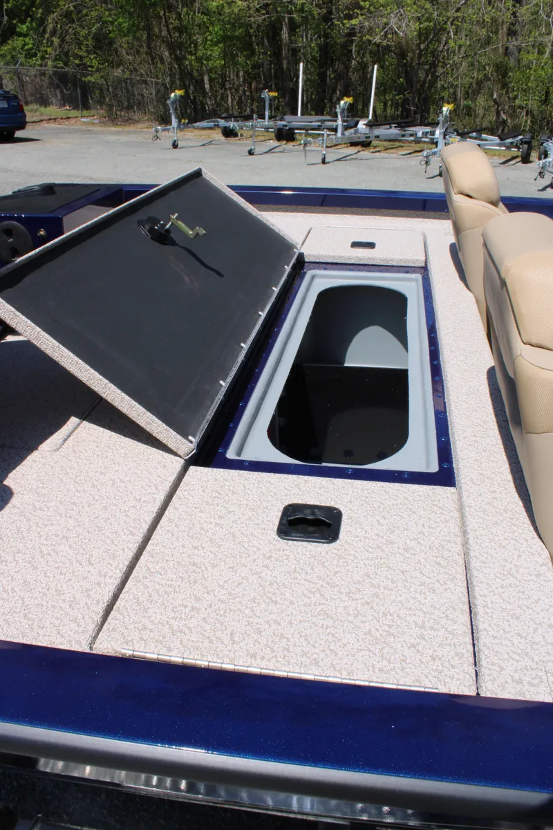 Slide: The Image of 2025 G3 Sportsman 1710 boat with open storage compartment and beige seating. - 20