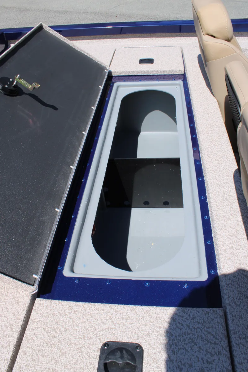 Slide: The Image of 2025 G3 Sportsman 1710 boat storage compartment with open lid. - 21
