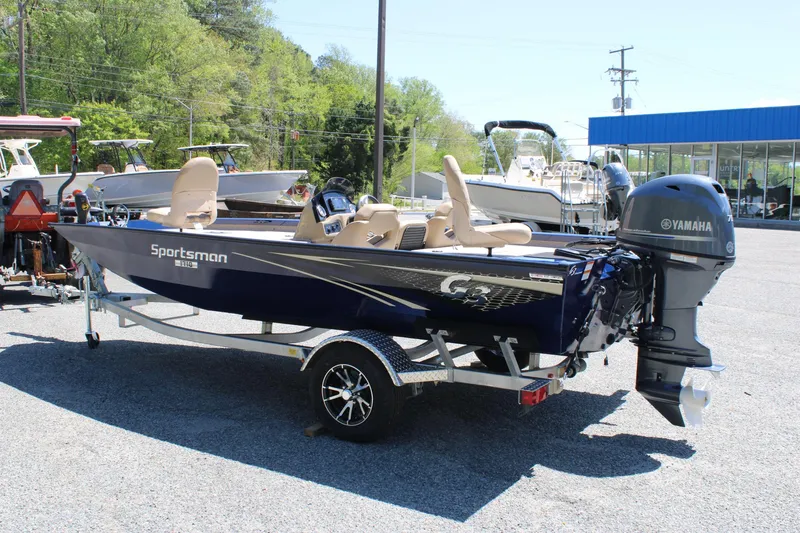 Slide: The Image of 2025 G3 Sportsman 1710 boat with Yamaha motor on trailer in outdoor showroom. - 3