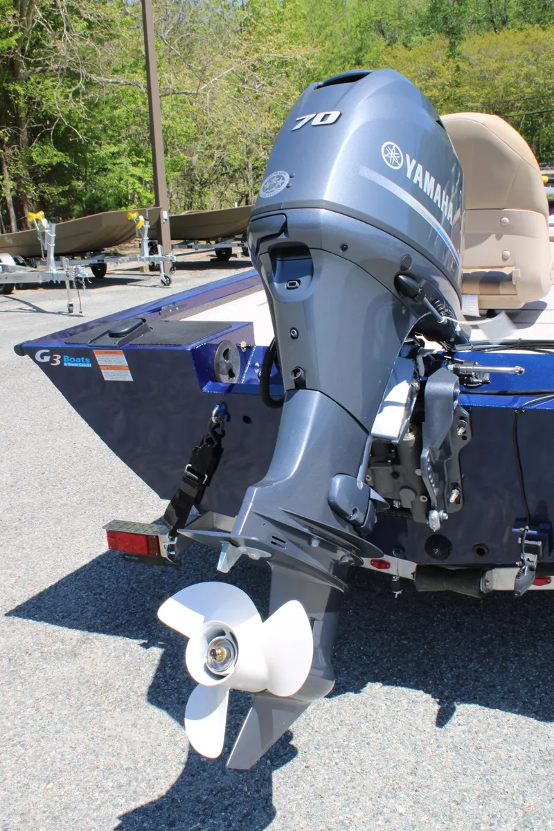 Slide: The Image of 2025 G3 Sportsman 1710 boat with Yamaha outboard motor, parked outdoors. - 4