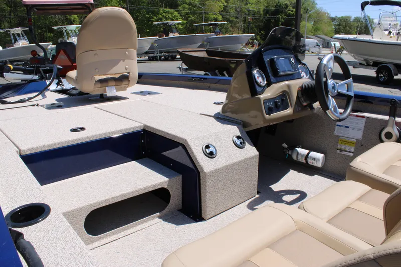 Slide: The Image of 2025 G3 Sportsman 1710 boat interior with steering console and seating. - 8
