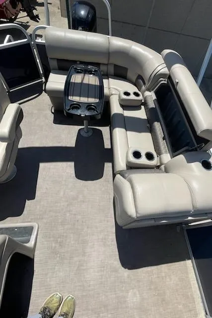 Slide: The Image of 2020 Sun Tracker Party Barge 20 DLX interior with seating and table. - 3