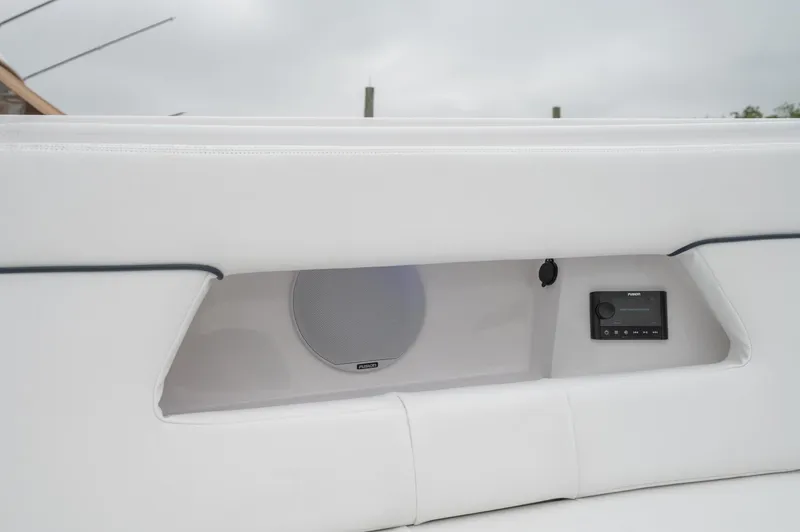 Slide: The Image of 2021 Southport 33 DC boat interior with speaker and control panel. - 22