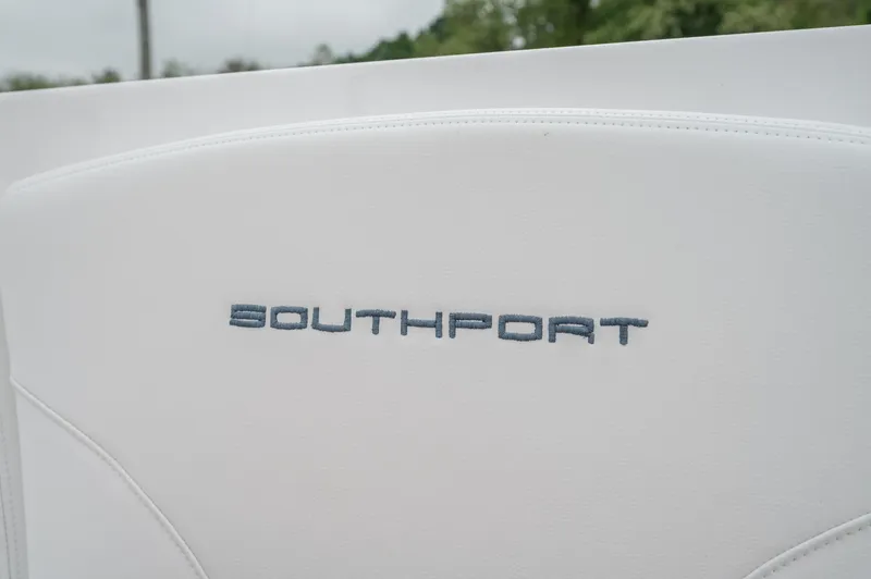 Slide: The Image of Southport 33 DC 2021 logo on white surface, close-up view. - 23
