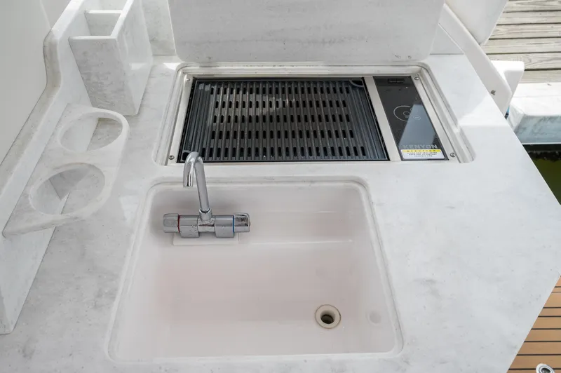 Slide: The Image of 2021 Southport 33 DC boat sink and grill station with modern design. - 39