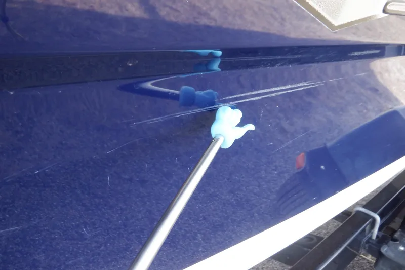 Slide: The Image of Blue 2014 Monterey 196MS boat with sleek silver graphics on the side. - 20