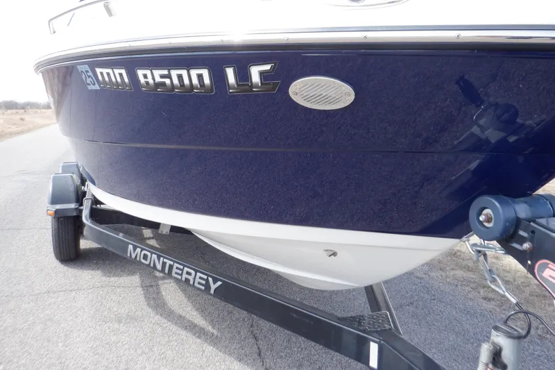 Slide: The Image of 2014 Monterey 196MS boat on trailer, blue and white hull, registration MN 8500 LC. - 24