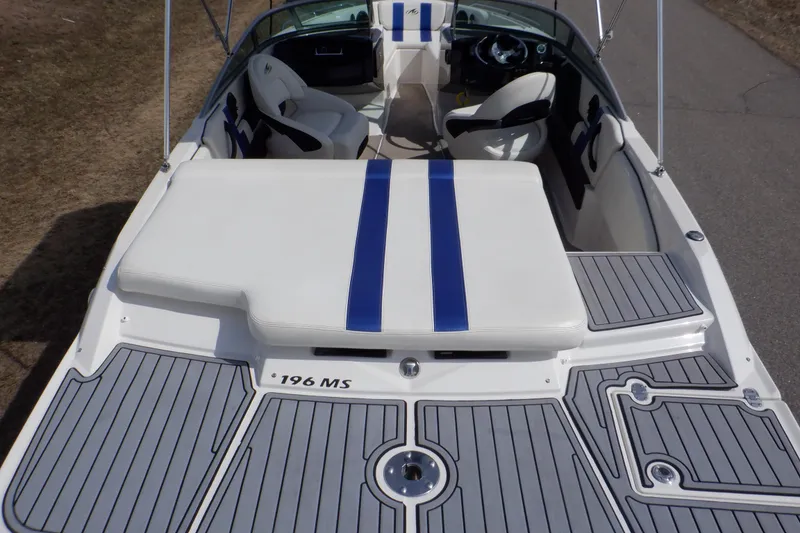 Slide: The Image of 2014 Monterey 196MS boat interior with white and blue seating, steering wheel, and dashboard. - 3