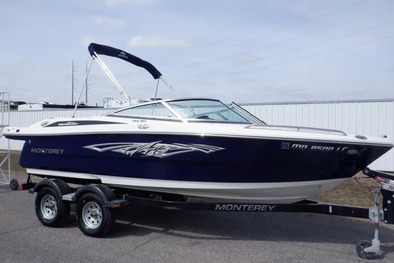 Slide: The Image of Trailer wheels of a 2014 Monterey 196MS on asphalt surface. - 30