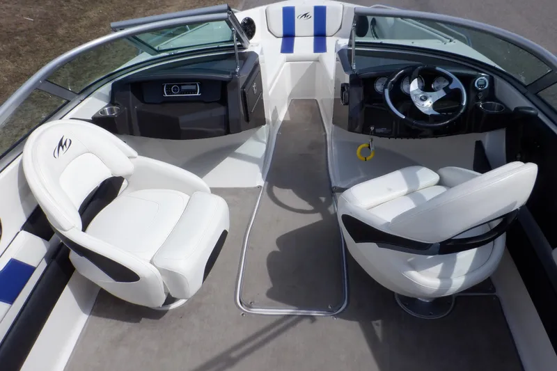 Slide: The Image of 2014 Monterey 196MS boat seat with blue stripes, showcasing sleek design and comfort. - 34