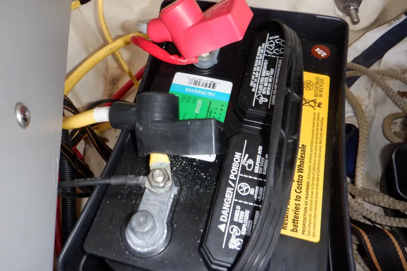 Slide: The Image of Cleaning white seat upholstery on 2014 Monterey 196MS boat with a blue brush. - 37