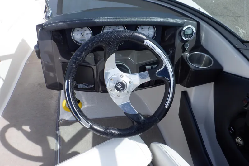 Slide: The Image of Steering wheel and dashboard of a 2014 Monterey 196MS boat. - 43
