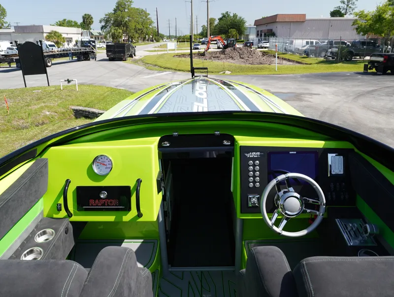 Slide: The Image of Interior view of 2025 Velocity Raptor speedboat, featuring modern dashboard and steering wheel. - 6