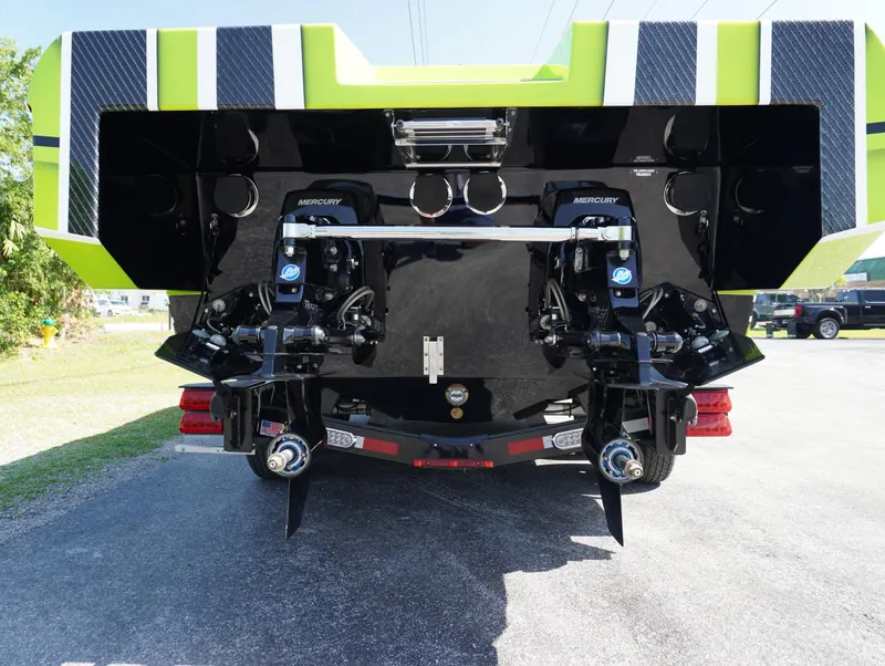 Slide: The Image of Rear view of 2025 Velocity Raptor boat with dual Mercury engines. - 8