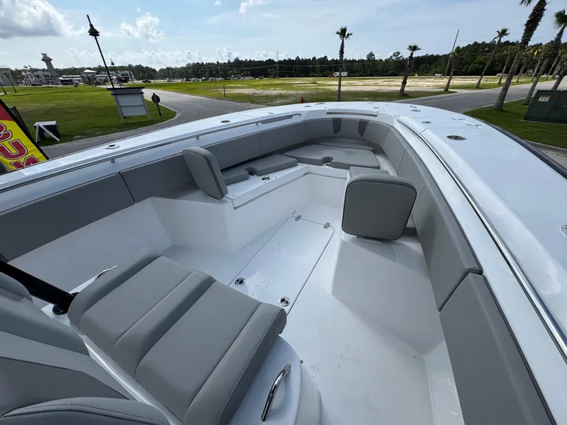 Slide: The Image of 2025 Cape Horn 32 XS boat interior with gray seating and spacious deck. - 15