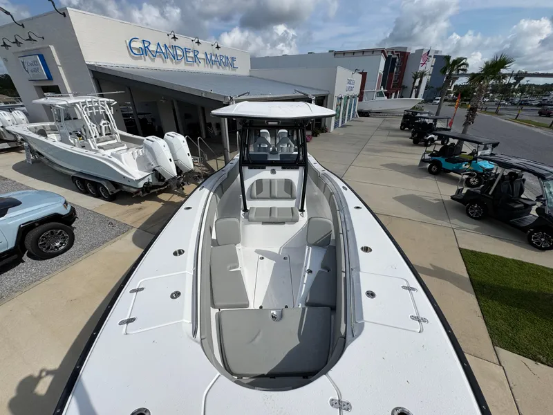 Slide: The Image of 2025 Cape Horn 32 XS boat displayed at Grander Marine dealership. - 18