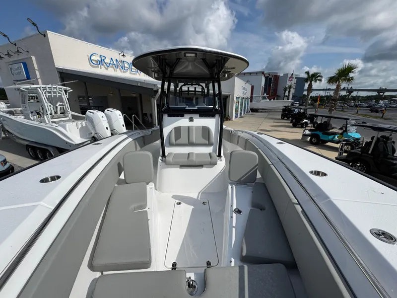 Slide: The Image of 2025 Cape Horn 32 XS boat with spacious deck and modern design at a marina. - 19