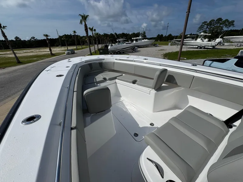 Slide: The Image of 2025 Cape Horn 32 XS boat interior with gray seating and open deck. - 20