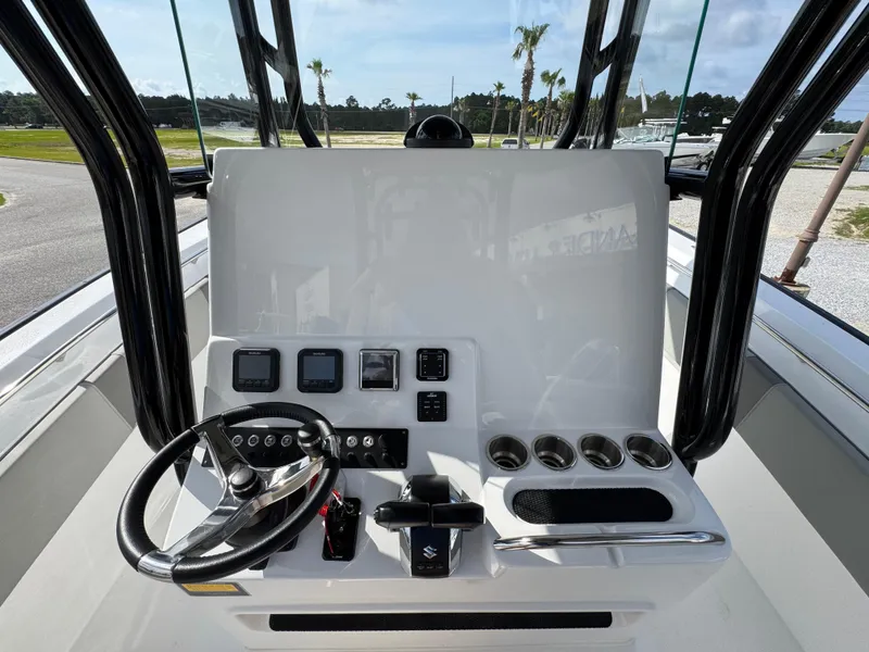 Slide: The Image of 2025 Cape Horn 32 XS boat dashboard with steering wheel and control panel. - 26