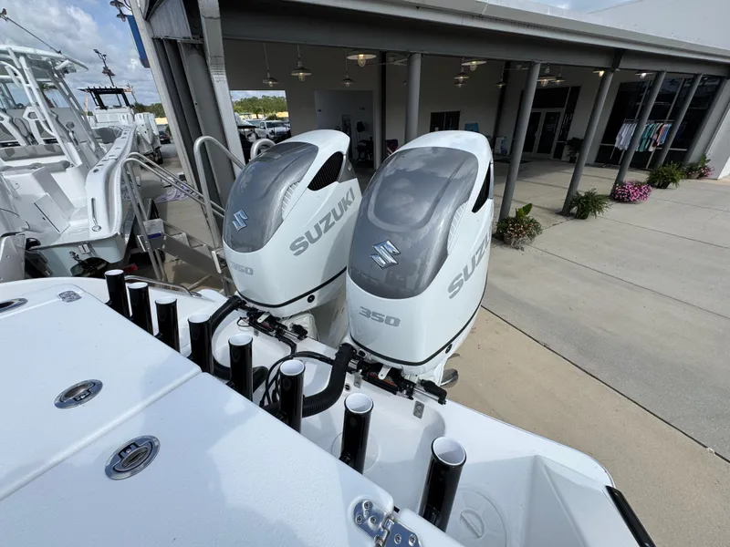 Slide: The Image of 2025 Cape Horn 32 XS boat with twin Suzuki 350 outboard engines. - 33