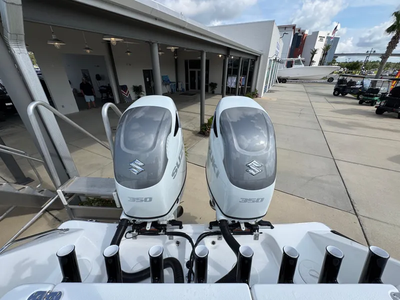 Slide: The Image of 2025 Cape Horn 32 XS with twin Suzuki 350 outboard engines at a marina. - 34