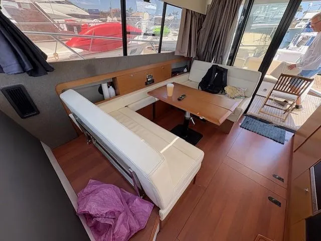 Slide: The Image of Interior of 2013 Jeanneau NC11 yacht with seating area and table. - 7