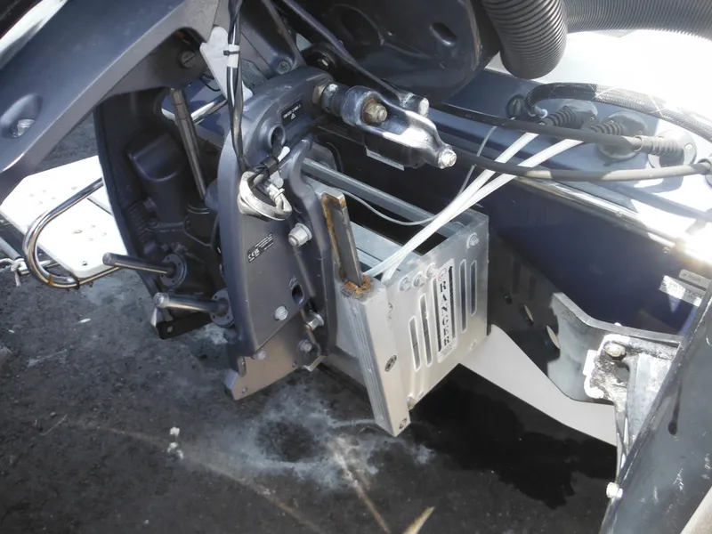 Slide: The Image of 2011 Ranger 2410 Bay Ranger boat engine compartment with mechanical components and wiring. - 12