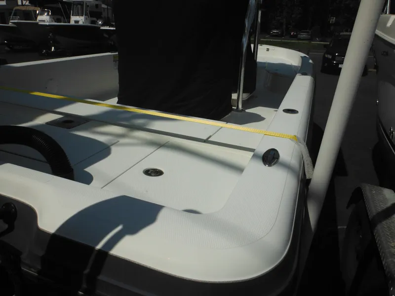 Slide: The Image of 2011 Ranger 2410 Bay Ranger boat deck with seating and storage compartments. - 16