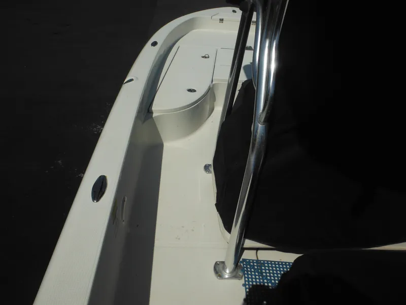 Slide: The Image of 2011 Ranger 2410 Bay Ranger boat interior with seating and railing. - 21