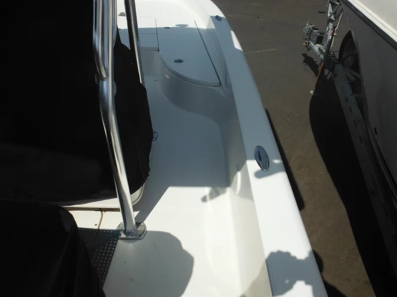 Slide: The Image of 2011 Ranger 2410 Bay Ranger boat deck with railing and storage compartment. - 22