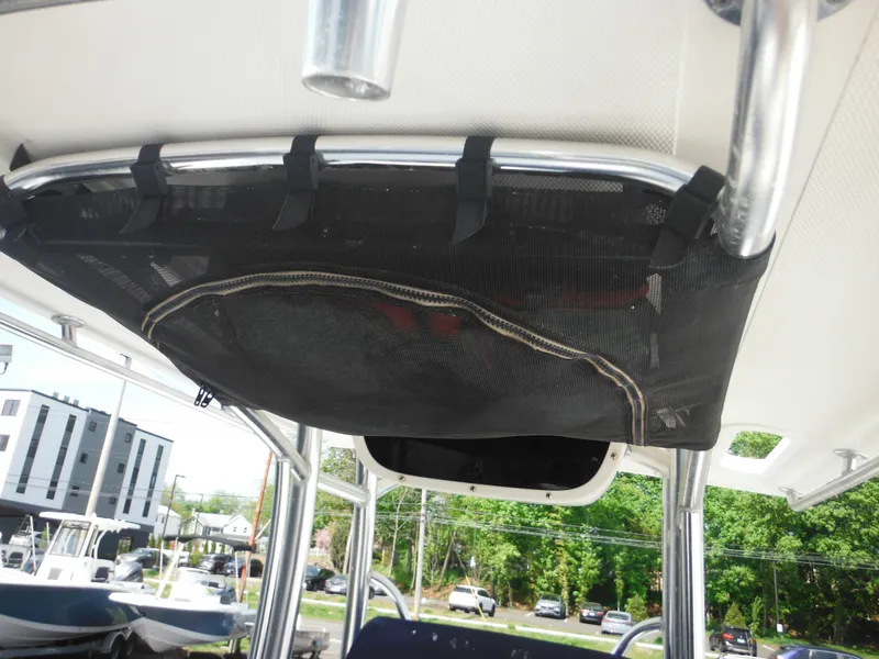 Slide: The Image of 2011 Ranger 2410 Bay Ranger boat with overhead storage netting and sturdy metal frame. - 25