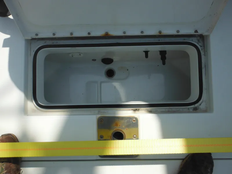 Slide: The Image of Open storage compartment on 2011 Ranger 2410 Bay Ranger boat deck. - 27