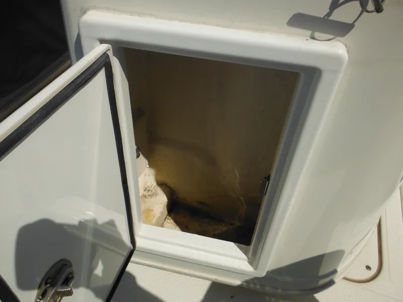 Slide: The Image of Open storage compartment on 2011 Ranger 2410 Bay Ranger boat. - 31