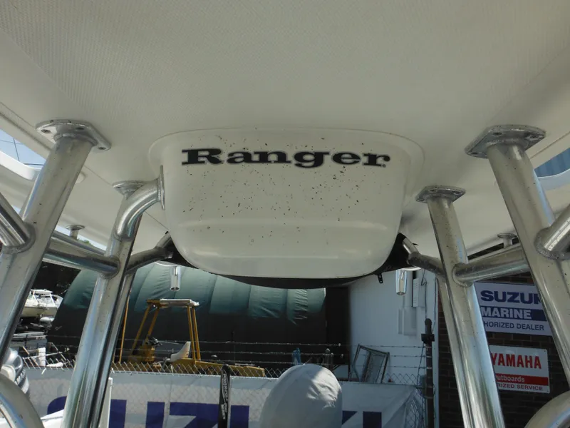Slide: The Image of 2011 Ranger 2410 Bay Ranger boat interior with visible branding and support structures. - 39