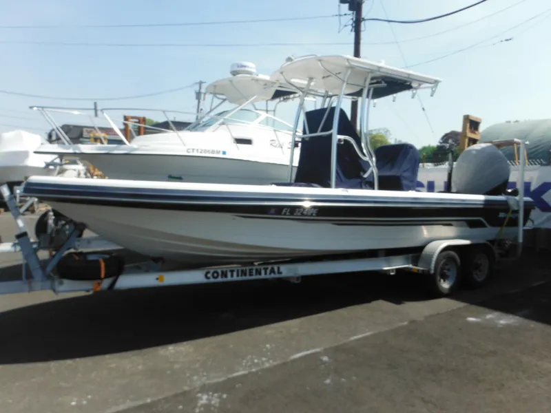 Slide: The Image of 2011 Ranger 2410 Bay Ranger boat on trailer, parked outdoors. - 4