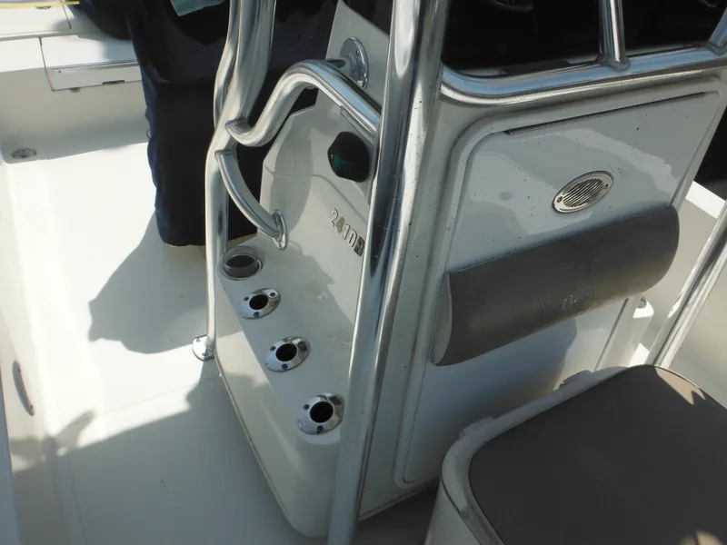Slide: The Image of 2011 Ranger 2410 Bay Ranger boat console with rod holders and seating. - 40
