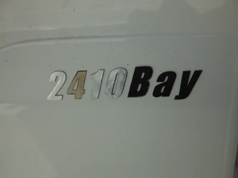 Slide: The Image of 2011 Ranger 2410 Bay model emblem on white surface. - 41