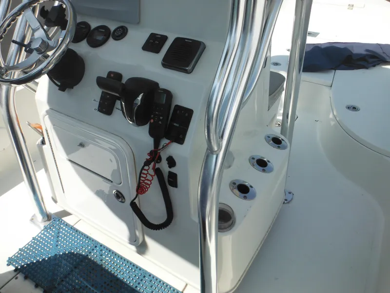 Slide: The Image of 2011 Ranger 2410 Bay Ranger boat console with steering wheel and controls. - 42