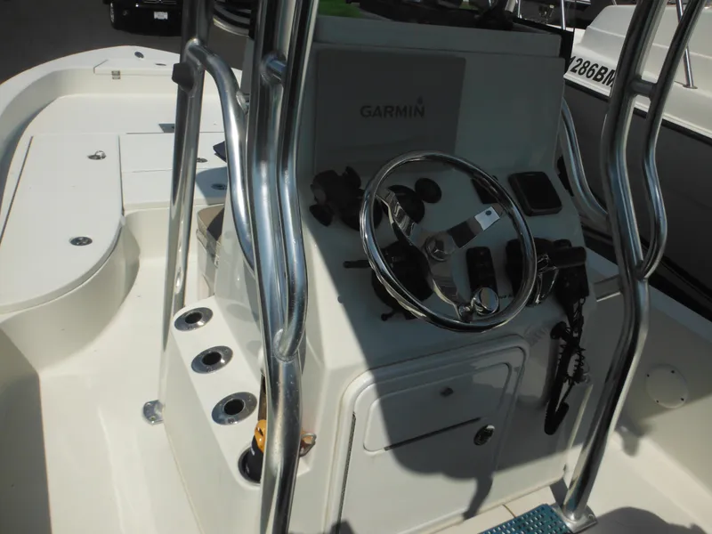 Slide: The Image of 2011 Ranger 2410 Bay Ranger boat console with Garmin system and steering wheel. - 45