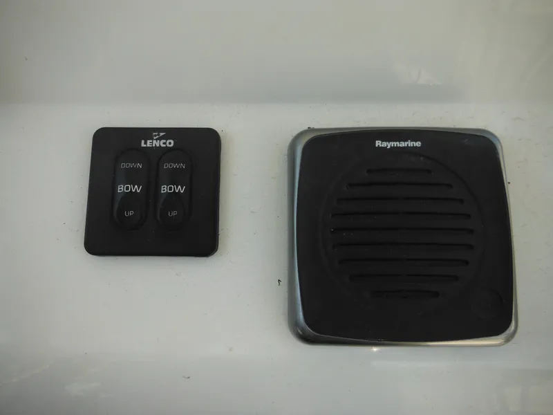 Slide: The Image of Lenco and Raymarine controls on 2011 Ranger 2410 Bay Ranger boat dashboard. - 50