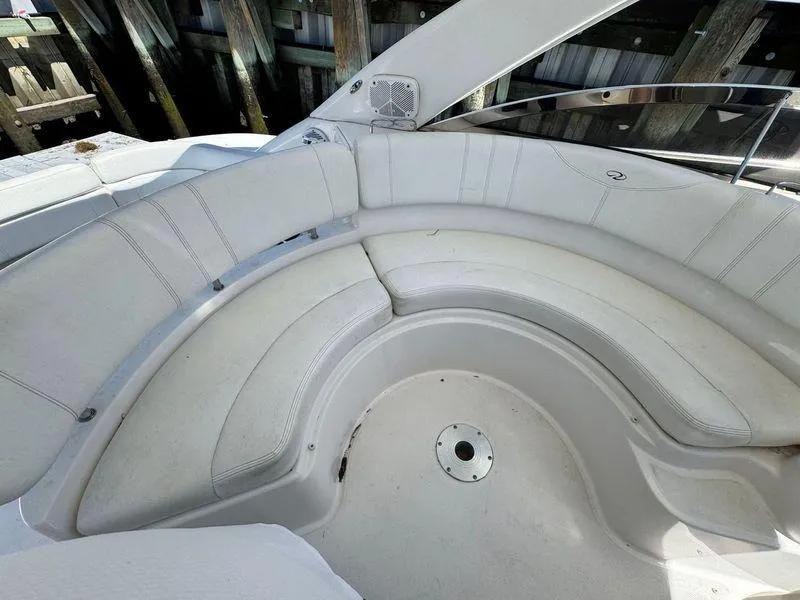 Slide: The Image of 2009 Regal Commodore 4060 boat interior with white seating and navigation equipment. - 12